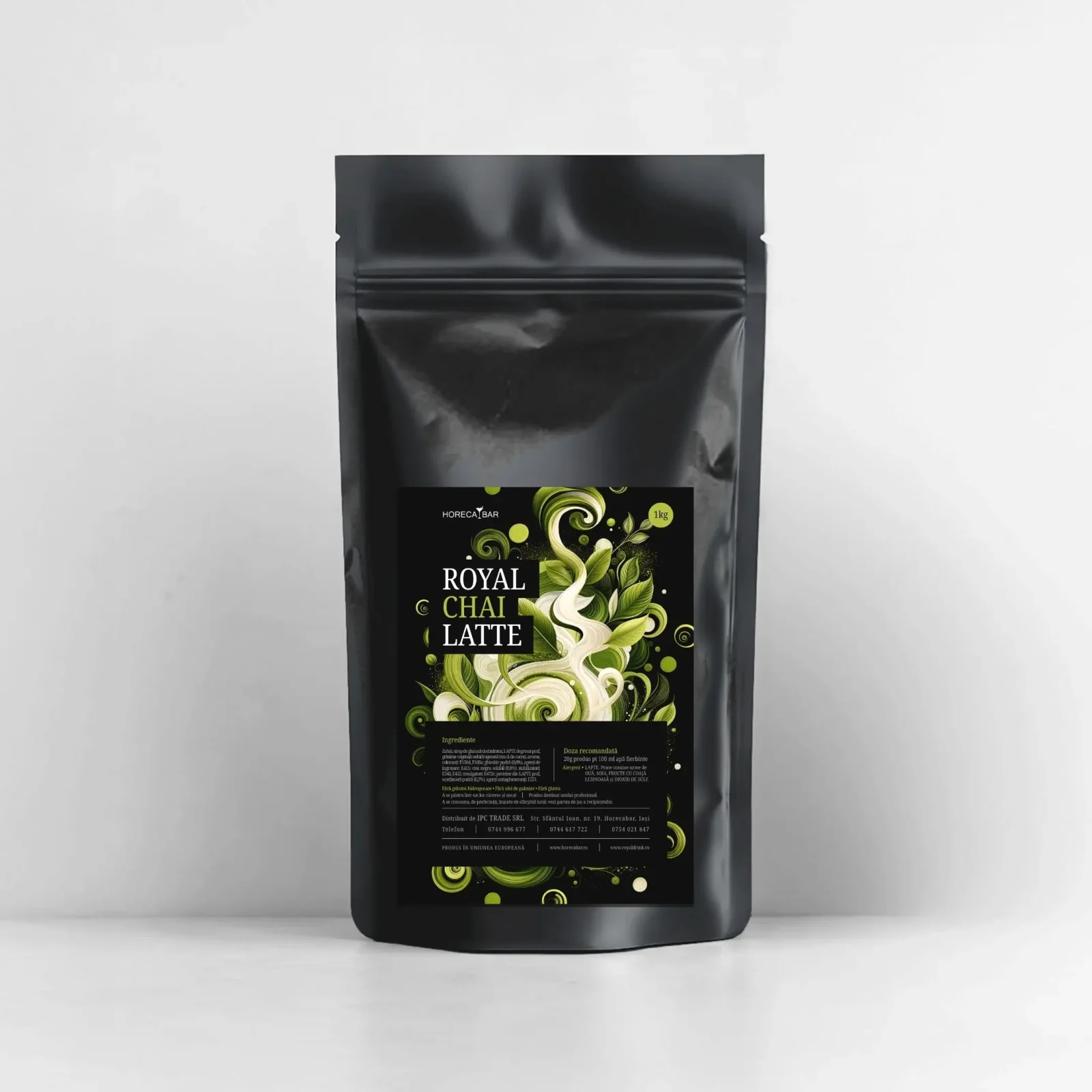 Black resealable stand up pouch with a glossy finish and a decorative black label showing green swirls reads ROYAL CHAI LATTE 1kg at the bottom of the label